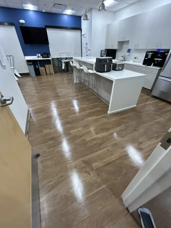 Clean office break room with shining floors